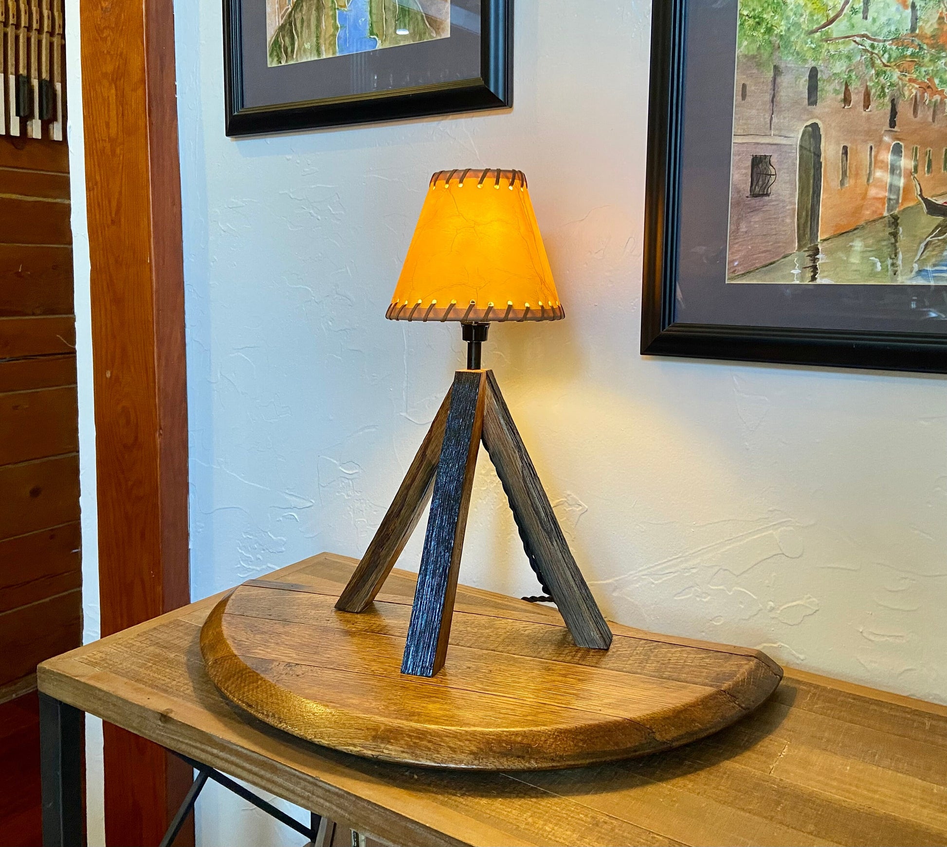 Whiskey barrel table lamp with leather shade mounted on barrel lid, perfect for the bar or mancave using genuine Kentucky bourbon barrels