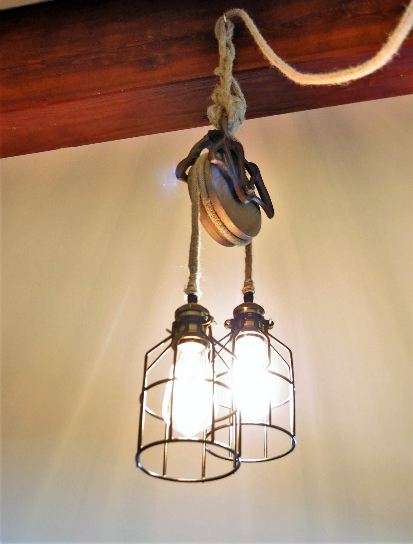Rustic farmhouse pulley lighting, pendant light with antique pulley for cabin decor, repurposed vintage pulley for kitchen / dining room