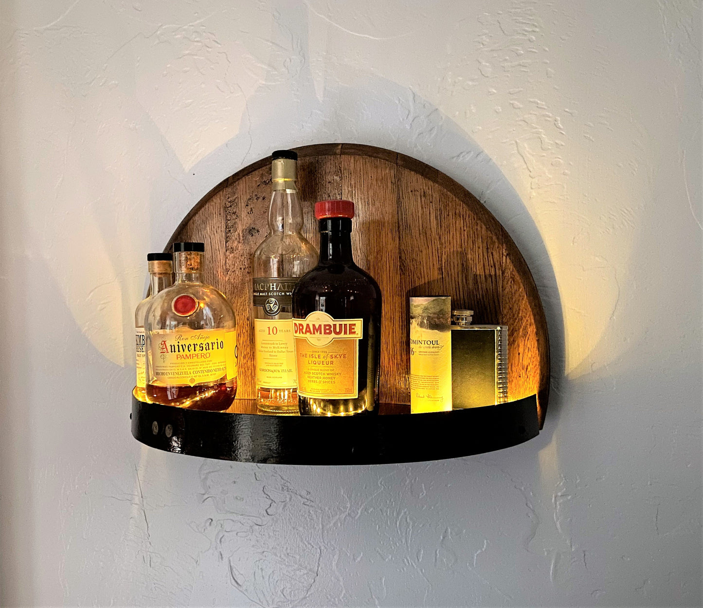Illuminated whiskey barrel liquor display shelf perfect for displaying your bar collection, handcrafted from Kentucky bourbon barrel