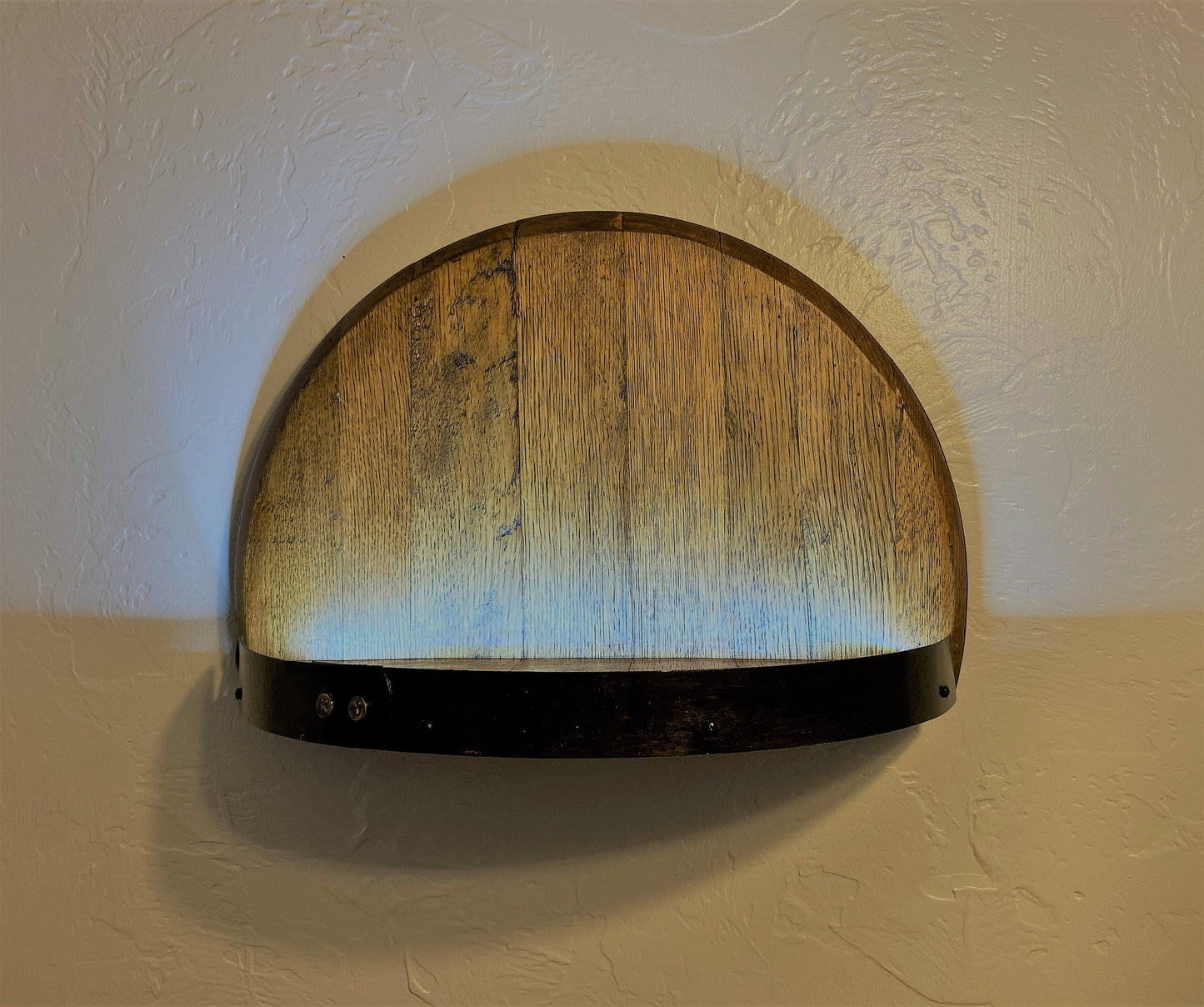 Illuminated whiskey barrel liquor display shelf perfect for displaying your bar collection, handcrafted from Kentucky bourbon barrel