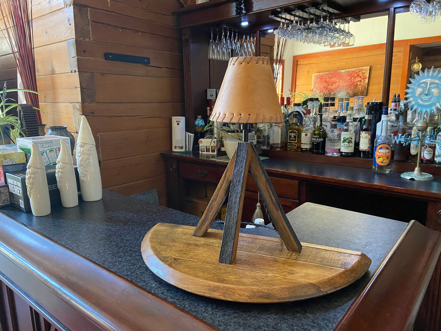 Whiskey barrel table lamp with leather shade mounted on barrel lid, perfect for the bar or mancave using genuine Kentucky bourbon barrels