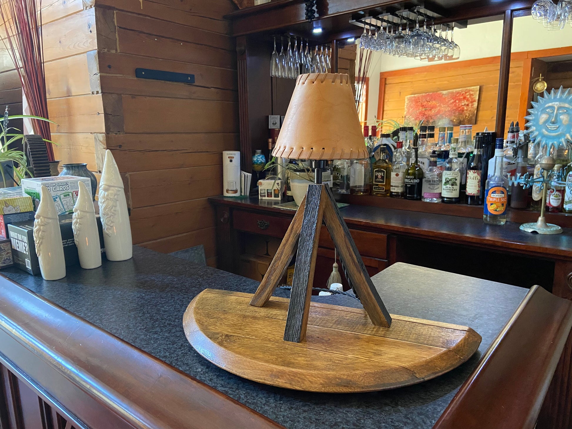 Whiskey barrel table lamp with leather shade mounted on barrel lid, perfect for the bar or mancave using genuine Kentucky bourbon barrels