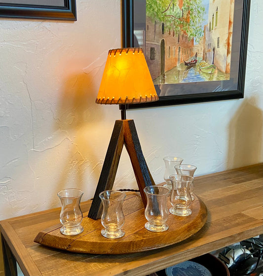 Whiskey barrel table lamp with leather shade mounted on barrel lid, perfect for the bar or mancave using genuine Kentucky bourbon barrels