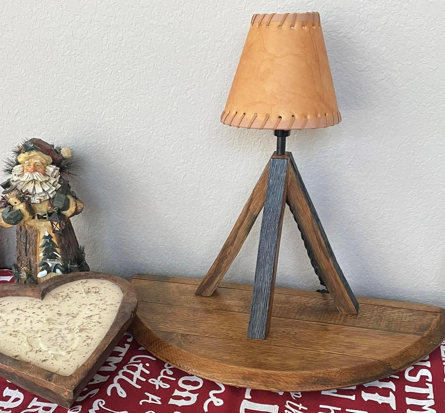 Whiskey barrel table lamp with leather shade mounted on barrel lid, perfect for the bar or mancave using genuine Kentucky bourbon barrels