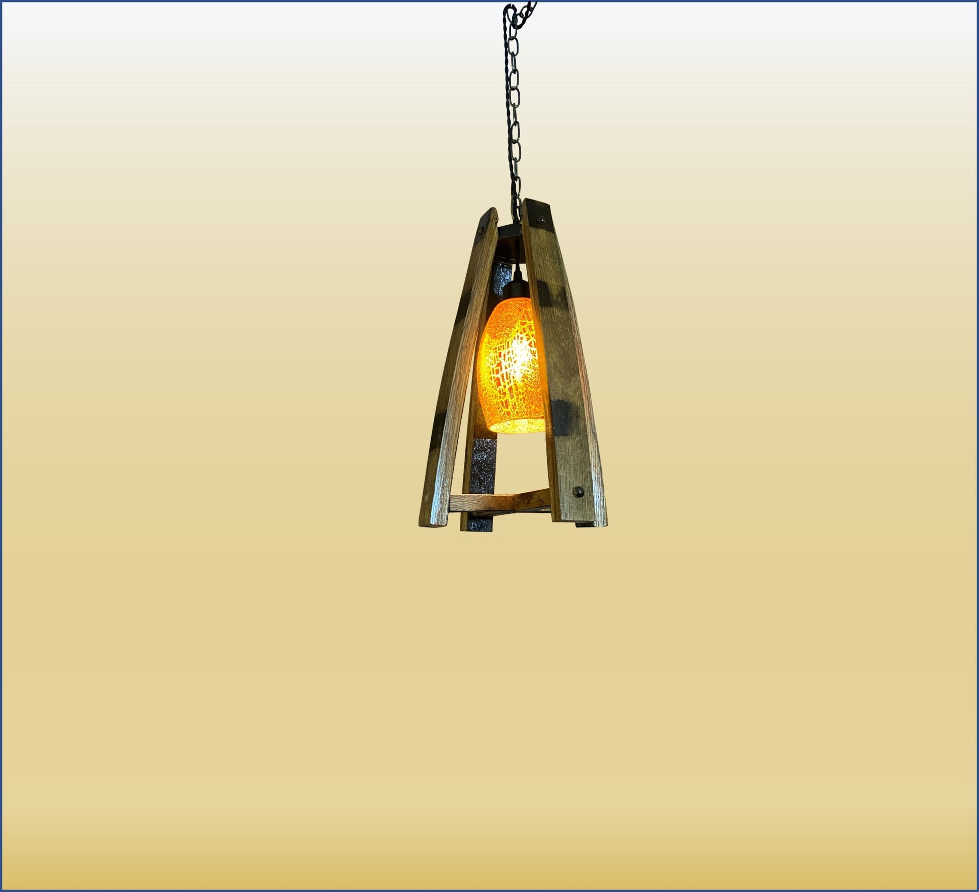 Handcrafted light fixture made from genuine barrel saves, accentuated by warm amber glass shade, perfect blend of rustic and elegance
