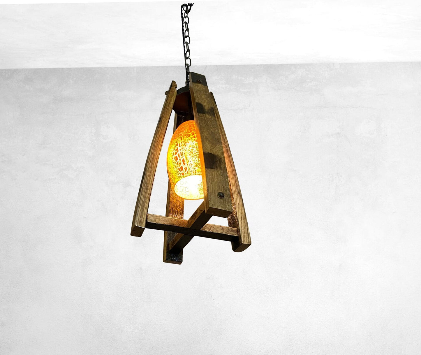 Handcrafted light fixture made from genuine barrel saves, accentuated by warm amber glass shade, perfect blend of rustic and elegance