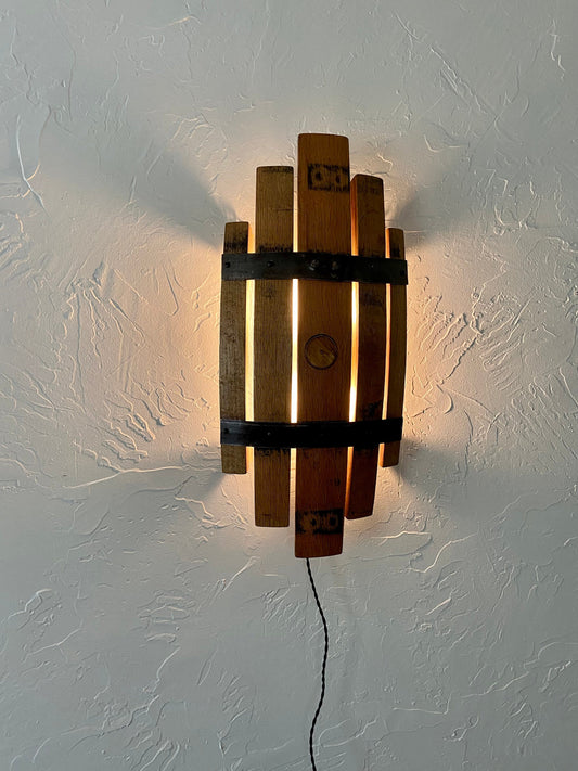 Bourbon barrel stave sconce, rustic charm from handcrafted wall light, whiskey barrel staves offers functionality with stylish wall art