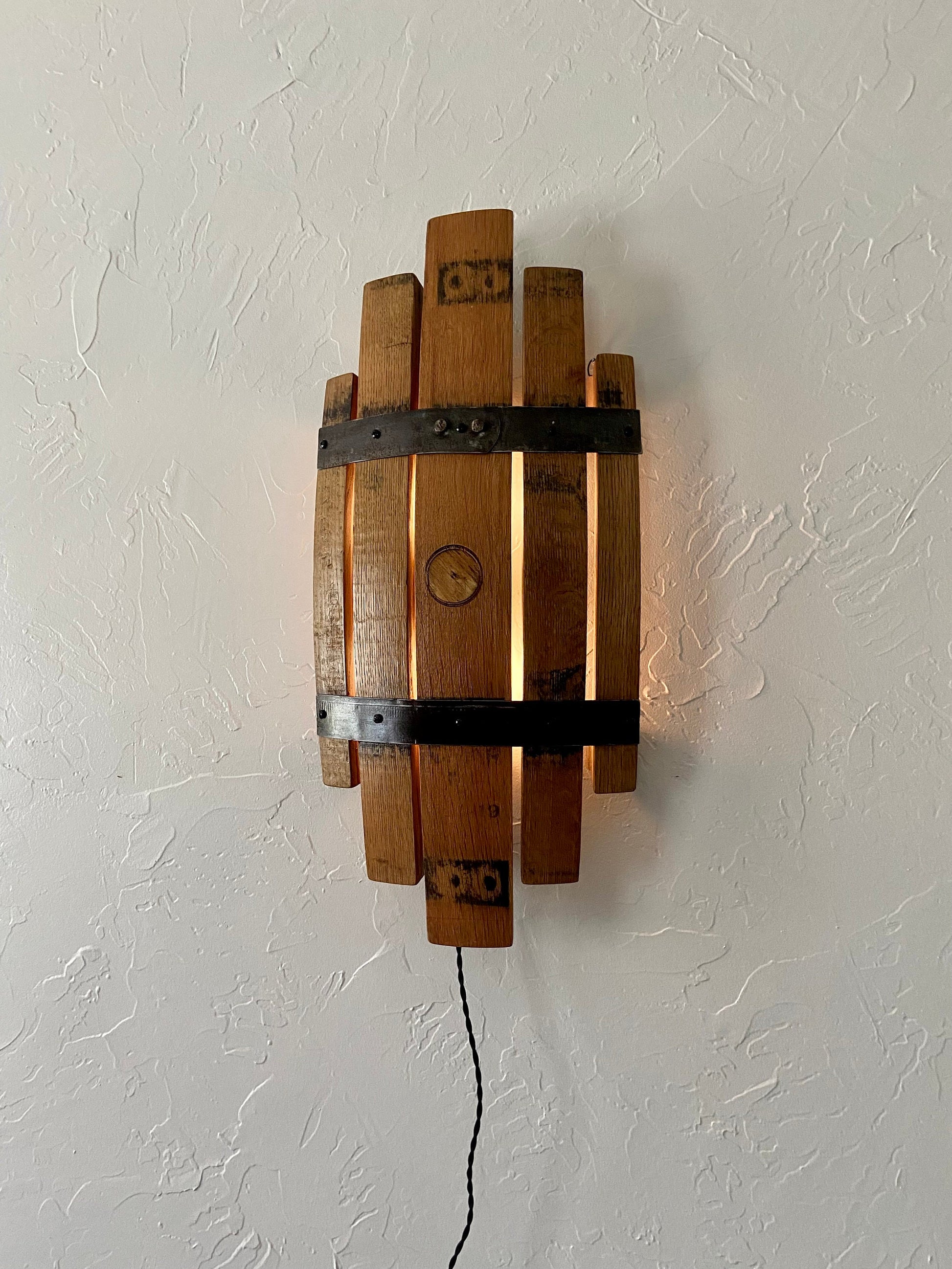 Bourbon barrel stave sconce, rustic charm from handcrafted wall light, whiskey barrel staves offers functionality with stylish wall art