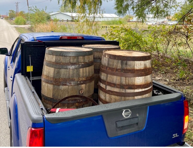 Wall sconce light from whiskey barrel staves, rustic decor with metal pulley, mancave bourbon barrel wall light for bar or cigar room