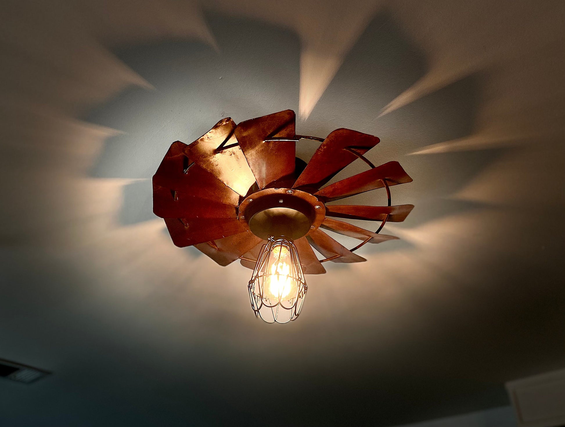 Rustic Farmhouse Windmill flush mount light fixture. Create a warm cozy vibe with this unique light for dining room or kitchen.