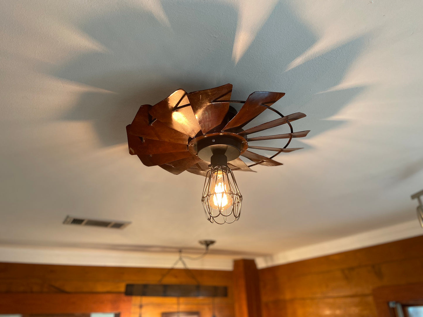 Rustic Farmhouse Windmill flush mount light fixture. Create a warm cozy vibe with this unique light for dining room or kitchen.