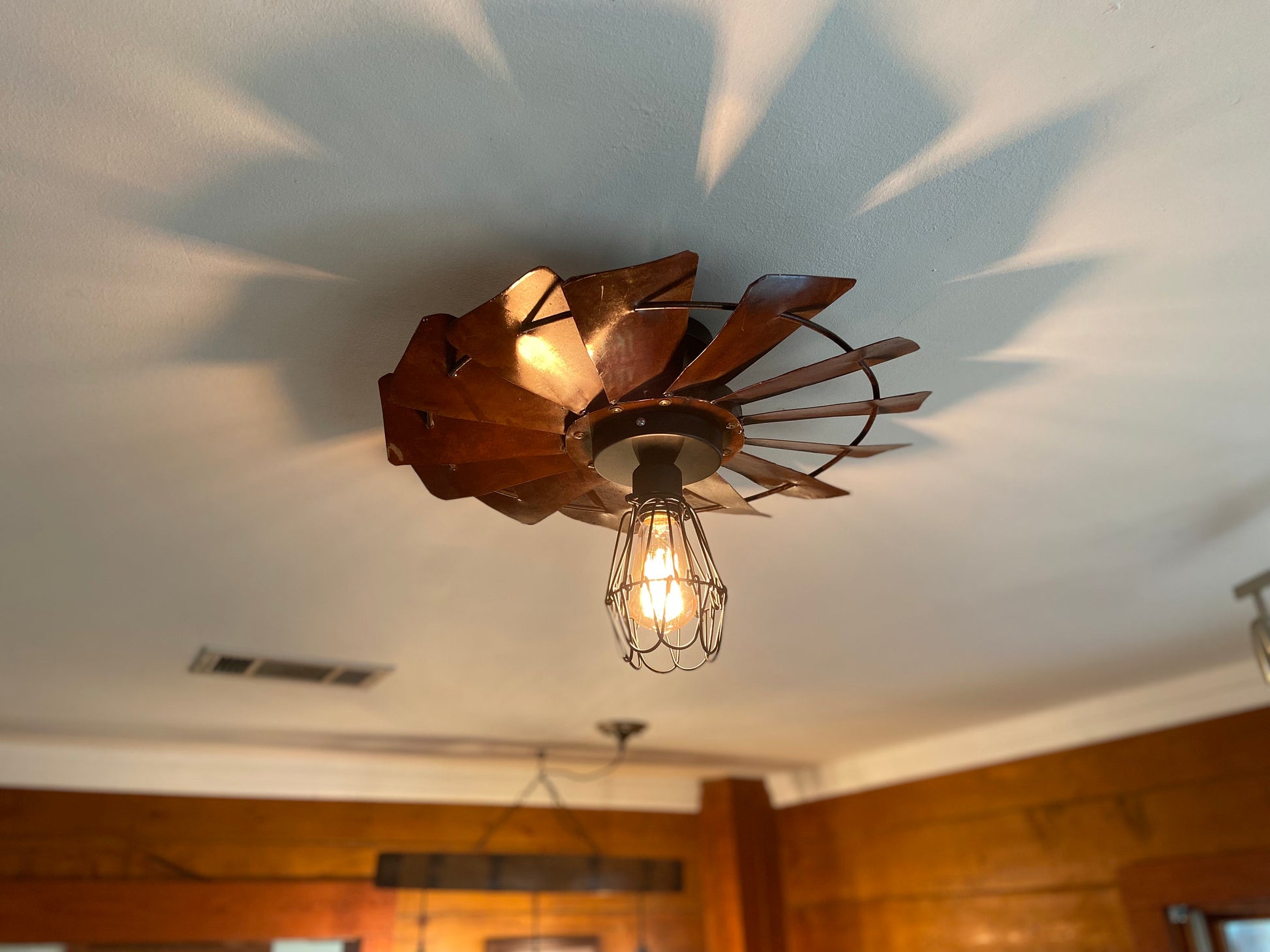 Rustic Farmhouse Windmill flush mount light fixture. Create a warm cozy vibe with this unique light for dining room or kitchen.